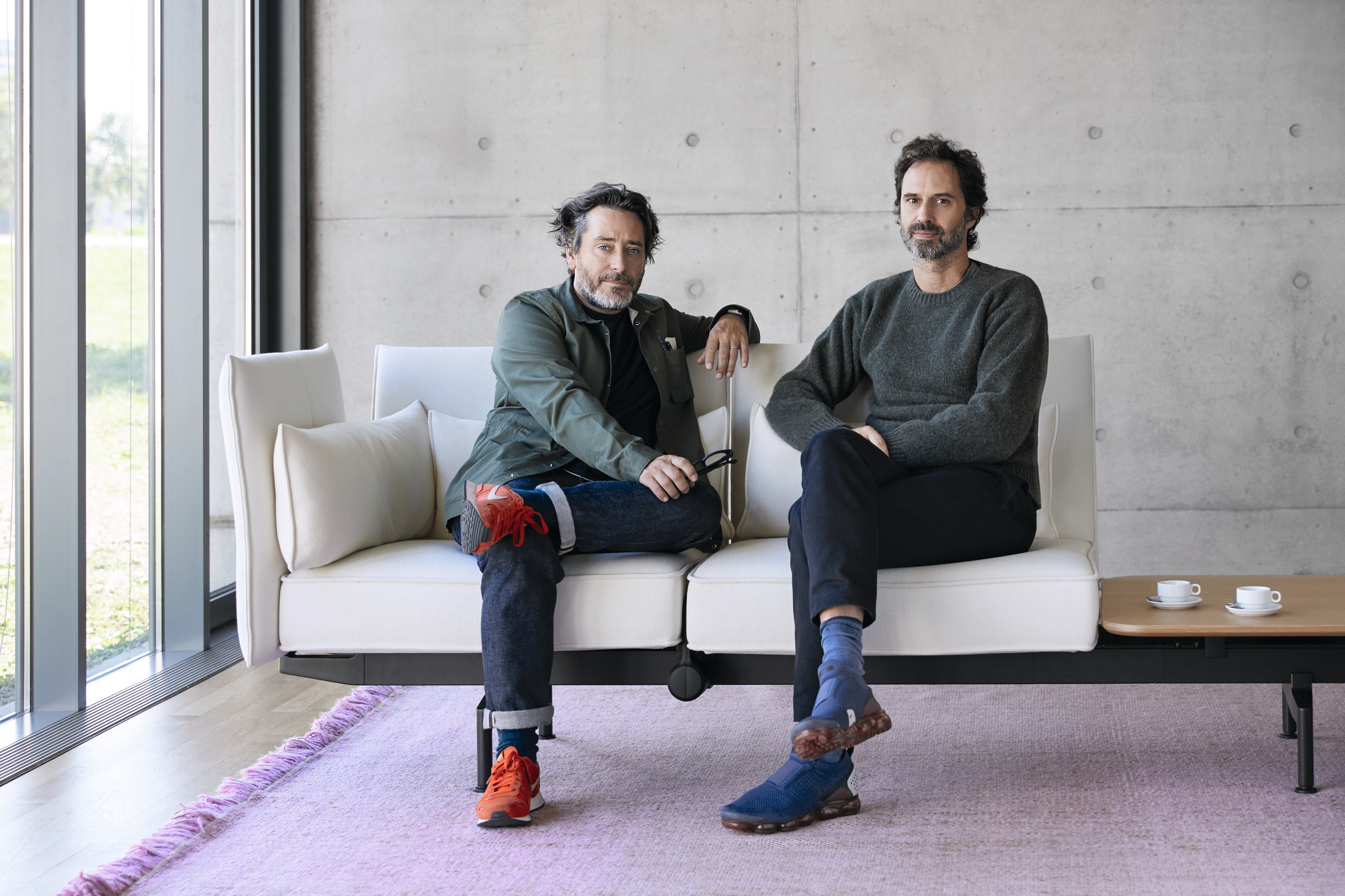 Portrait of Edward Barber & Jay Osgerby sitting on a couch, for AXOR.